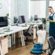 Professioal cleaner cleaning the office floor